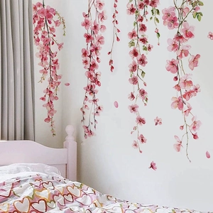 Pink floral wall stickers featuring hanging flower vines for a cozy modern bedroom decor