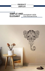 Detailed close-up of elephant wall decal with mandala floral patterns in a minimalist room