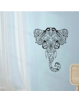 Detailed mandala elephant wall sticker with intricate black geometric patterns on a blue wall