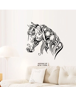 Modern tribal horse silhouette wall sticker in a minimalist living room setting