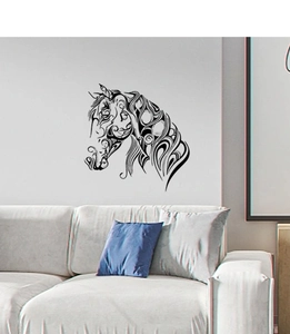 Detailed view of minimalist horse head line art wall sticker above a living room sofa