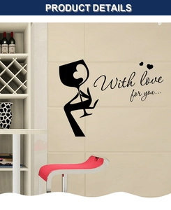 Detail of minimalist black wine glass wall sticker with love phrase on white tile surface