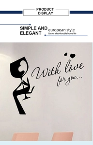 Close-up of black removable wall sticker featuring hand holding wine glass with hearts