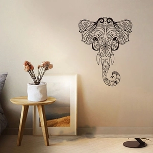 Mandala elephant wall sticker with black geometric patterns in a cozy living room decor