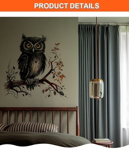 Detail view of realistic black owl wall sticker on branches in a bedroom setting