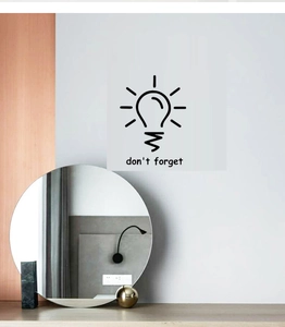 Modern wall sticker with black light bulb icon and Don't Forget phrase on gray wall
