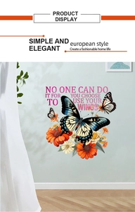 Detail of butterfly floral wall sticker with motivational English quote on blue wall
