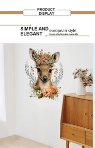 Detail display of artistic floral deer wall decal in a modern living room setting
