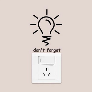 Creative bulb wall sticker with 'don't forget' text above a light switch plate