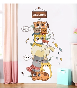 Detailed view of cute cartoon cat wall stickers for home decoration on a white wall