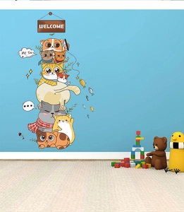 Detail of cartoon cats wall decal with Welcome sign on blue wall background