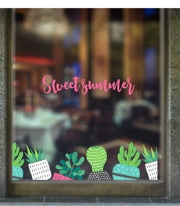 Detail of sweet summer window decals with cactus and succulent designs on glass
