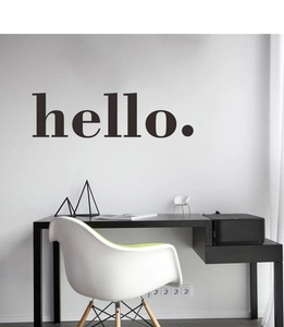 Minimalist black hello wall decal sticker displayed on a clean white living room wall