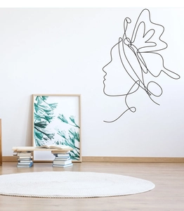 Detail of minimalist single line wall art sticker featuring a female profile silhouette