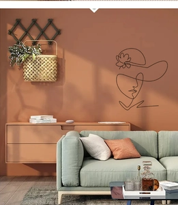 Minimalist line art wall decal featuring a woman silhouette in a modern living room