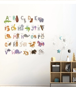 Detailed view of educational animal alphabet wall stickers in a cozy kids room decor