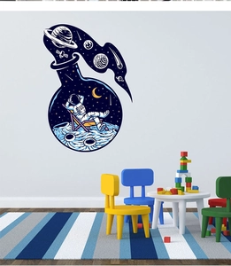 Detail of space astronaut sitting on a moon inside a creative glass bottle wall sticker