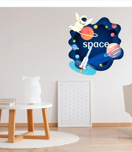 Space wall decals featuring an astronaut on a whale with planets for kids' room
