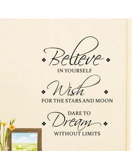 Detail showing 'Believe IN YOURSELF' vinyl wall decal applied to a bedroom wall