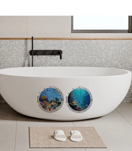Submarine window wall decals with tropical fish applied to a modern white bathtub