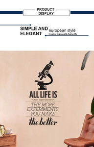 Detail of vintage wall sticker featuring a microscope icon and inspirational quote on wall