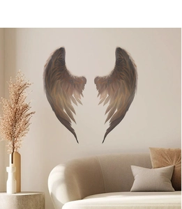 Detailed close-up of gradient brown wing wall stickers in a minimalist living room setting
