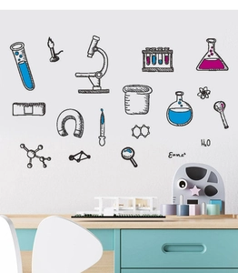 Detail view of science laboratory wall decals with microscope and chemical flask on white wall