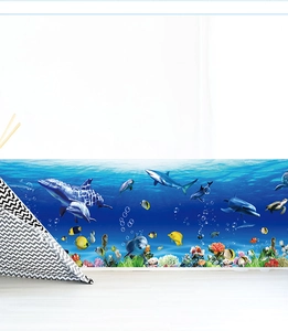 Detail of underwater world wall border sticker with dolphins and coral in a kids room
