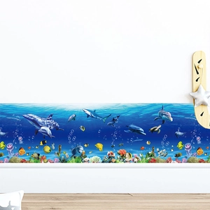 Ocean world wall decal featuring dolphins and sea turtles on a blue underwater background