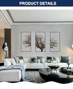 Modern Nordic gray tree triptych wall art showing 3 panels over a white leather sofa