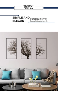 Detail of Nordic grey tree triptych wall art with black frames in a modern living room