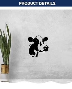 Detail view of a minimalist black cow head wall decal on a modern gray concrete wall