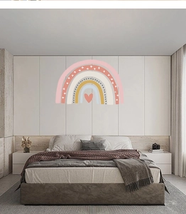 Detail of bohemian rainbow wall sticker with heart pattern and morandi colors in bedroom