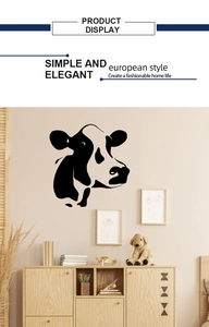 Detail view of a black bull head wall sticker displayed in a modern living room setting