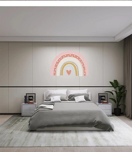 Detailed close-up of rainbow wall stickers with heart pattern in a cozy bedroom setting