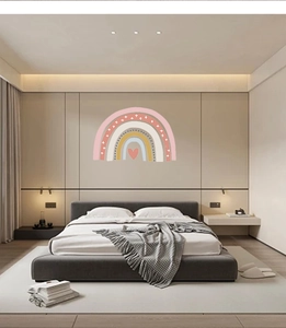 Detail view of Bohemian rainbow wall stickers with Morandi colors in a cozy bedroom decor