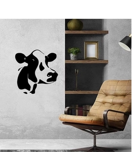 Minimalist black and white cow head silhouette wall decal on grey industrial wall