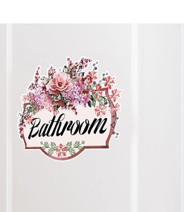 Detail view of a floral bathroom door sticker with pink roses and vintage script text