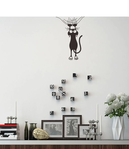 Detailed view of DIY wall clock with climbing black cat wall sticker and acrylic numeric blocks