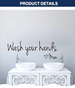 Close-up of Wash your hands wall sticker with heart and Mom signature on white wall