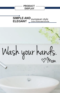 Detail of Wash Your Hands Mom wall sticker on a bathroom mirror with marble background