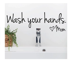 Modern bathroom wall sticker with Wash your hands Mom quote on white wall near faucet