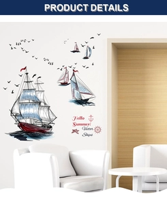 Detail of nautical wall decals showing sailboats, anchors, and gulls on a white wall