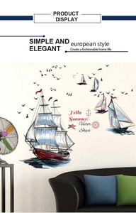 Detailed view of nautical sailboat and seagull wall stickers in a cozy living room scene