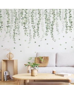 Detailed view of hanging green vine wall stickers in a modern minimalist living room