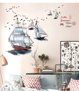 Detail showing vintage nautical wall stickers with sailboats and gulls on a living room wall
