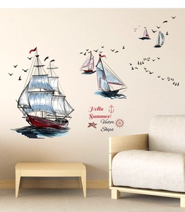 Detail view of sailboat wall stickers with seagulls in a cozy living room scene