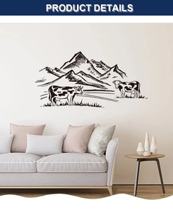 Detail of wall decal showing hand-drawn black mountain lines and cows on indoor wall