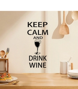 Keep Calm and Drink Wine black wall decal applied in a warm modern kitchen setting