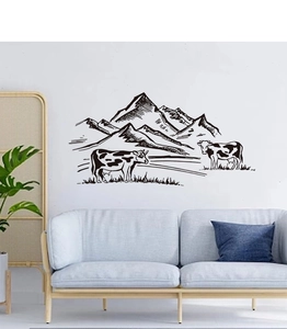 Detail of a black cow pasture wall sticker in a minimalist living room interior decor